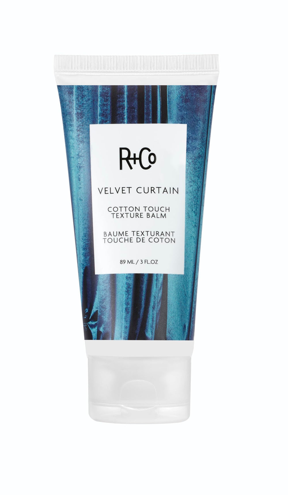 R+Co Velvet Curtain Balm bottle showing soft volume and light hold.