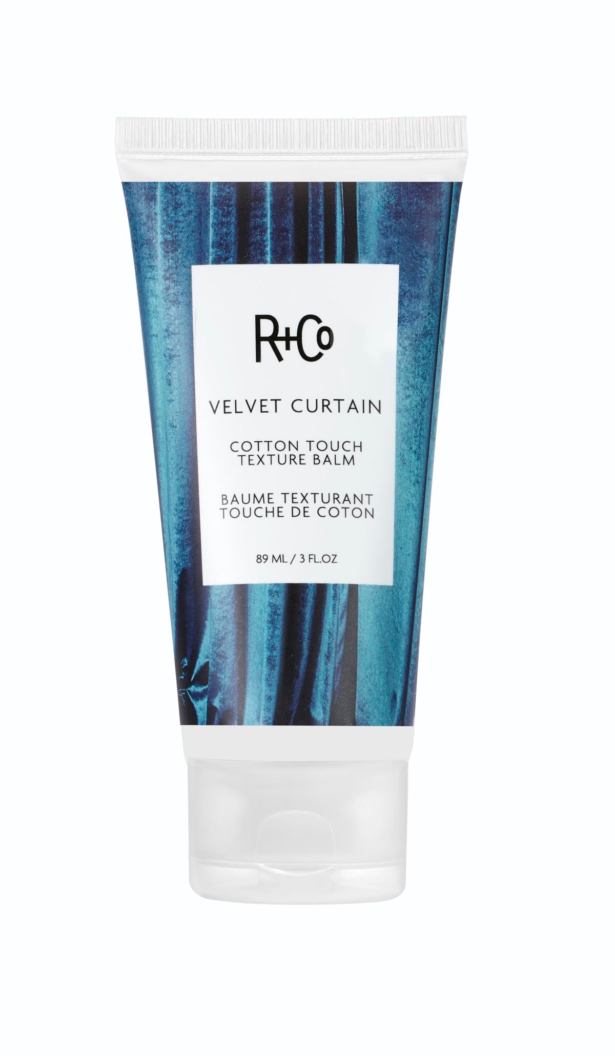 R+Co Velvet Curtain Balm bottle showing soft volume and light hold.