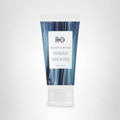 R+Co Velvet Curtain Balm close-up reveals creamy formula for hold.