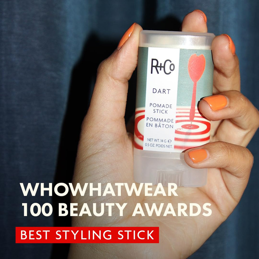 R+Co DART Hair Wax Stick smoothing strands for a clean finish.