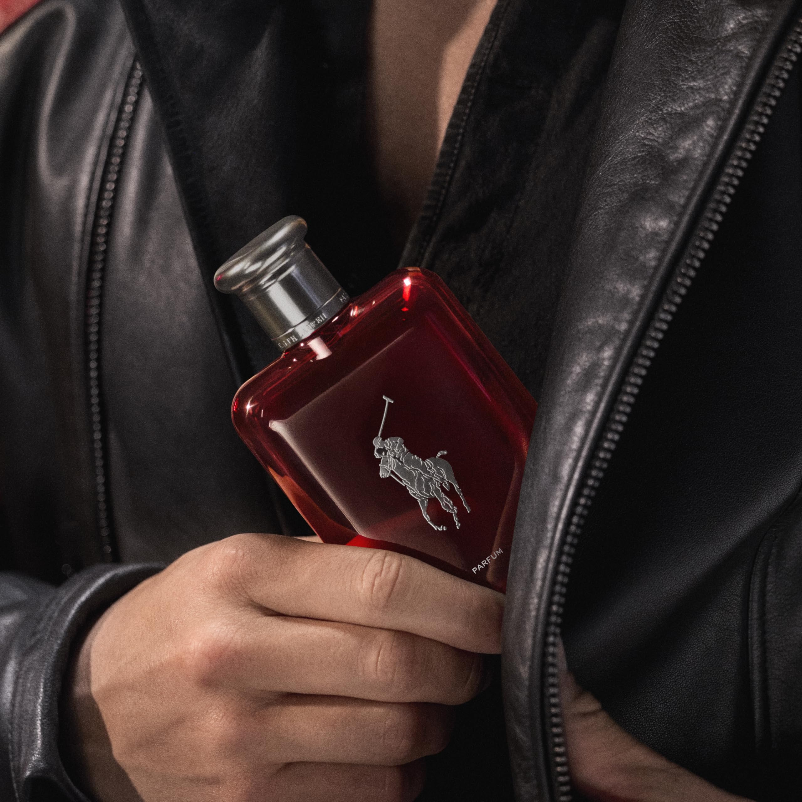 Ralph Lauren Polo Red Parfum amber-woody imagery evokes rugged sophistication for daily wear.