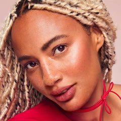 Rare Beauty Enliven peach-luminizer with gold flecks for subtle glow