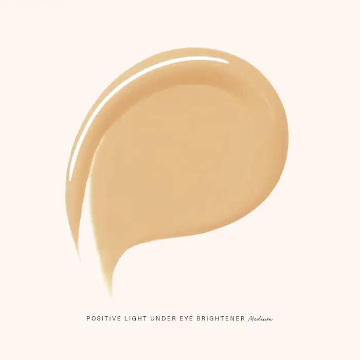 Rare Beauty under eye brightener Medium application on skin demonstrates lightweight coverage
