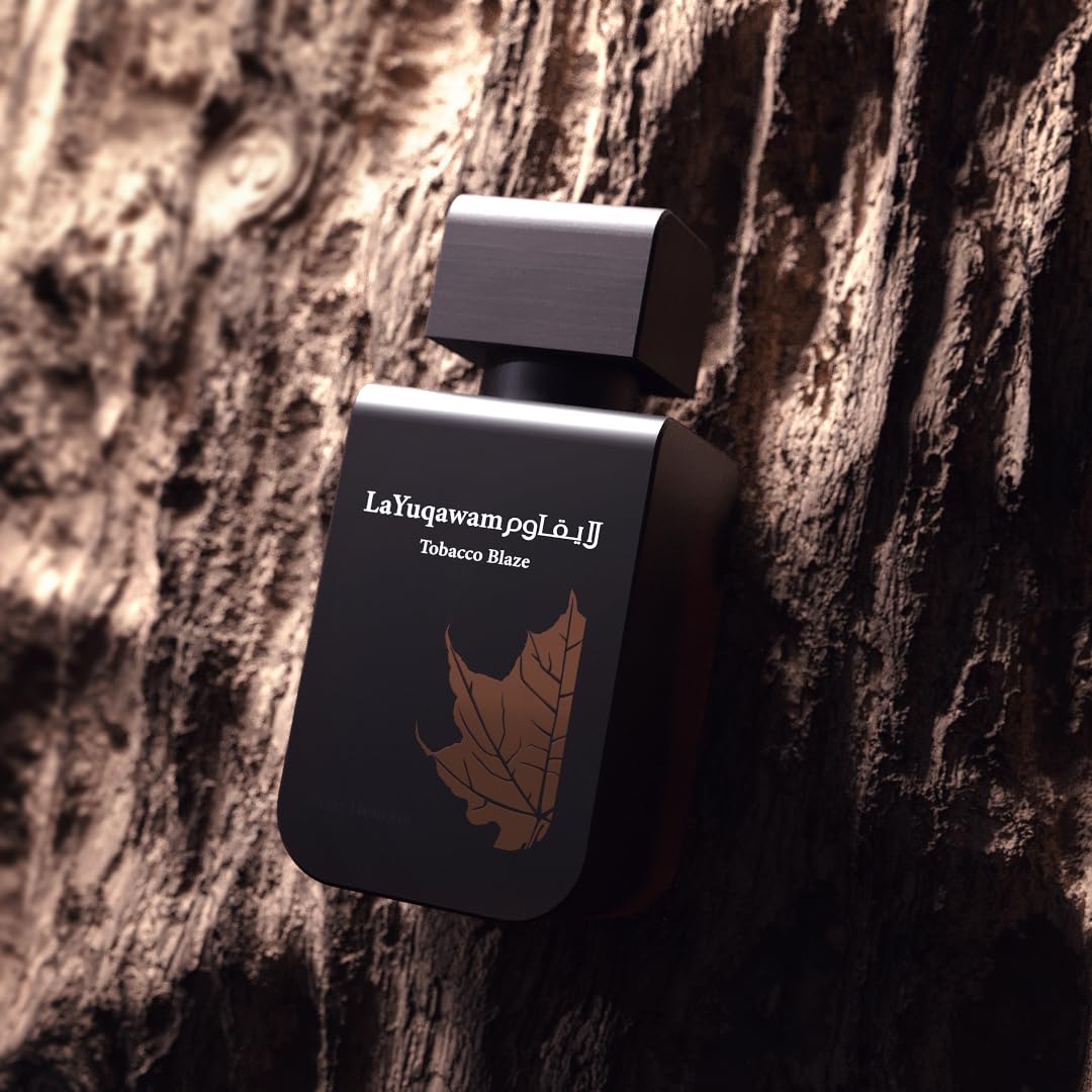 Rasasi La Yuqawam Tobacco Blaze oud-essence image suggests luxurious, long-lasting fragrance.