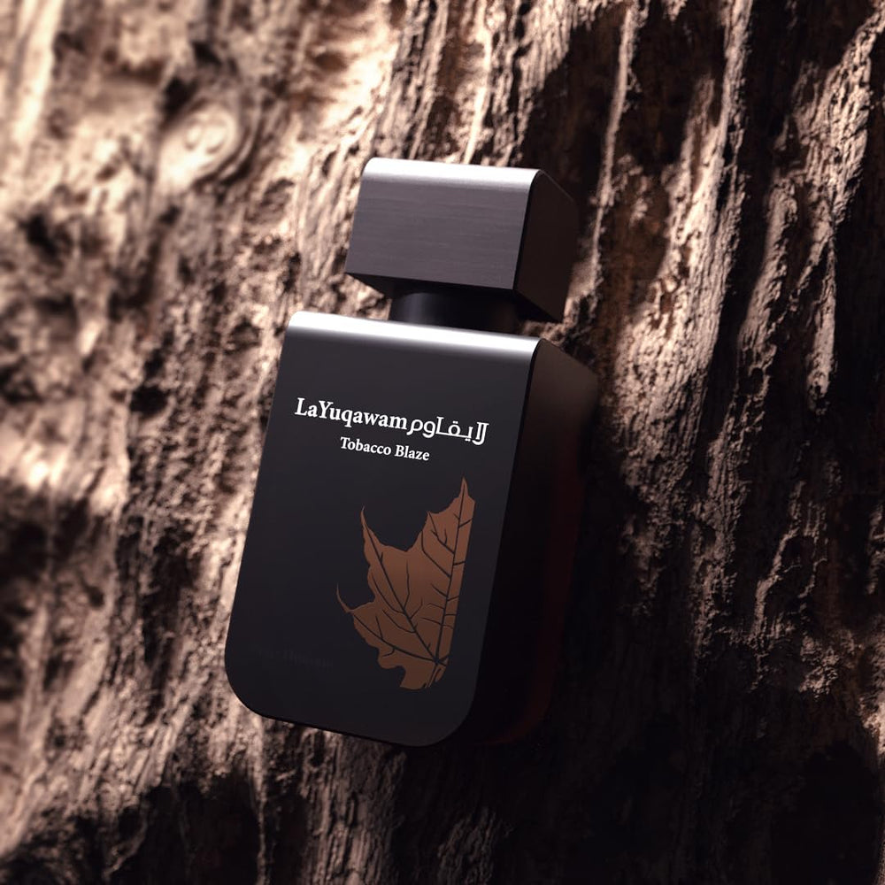 Rasasi La Yuqawam Tobacco Blaze oud-essence image suggests luxurious, long-lasting fragrance.