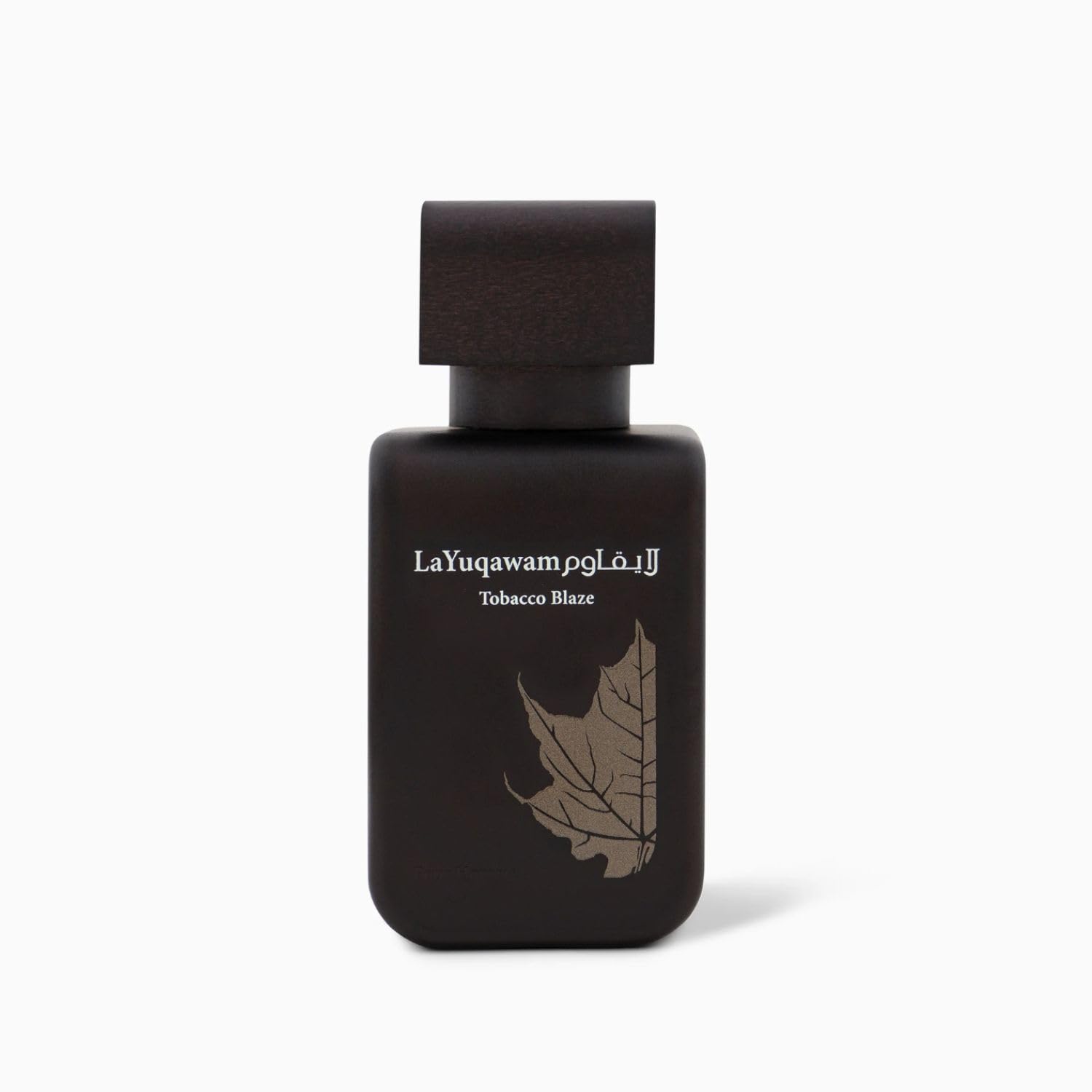 Rasasi La Yuqawam Tobacco Blaze wood-note close-up emphasizes cedarwood and amber warmth.