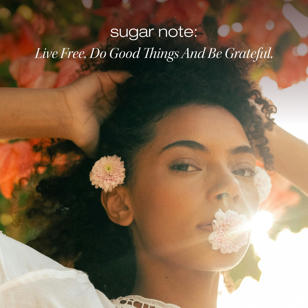 Hands apply RAW SUGAR Grow Pro shampoo to scalp during routine.