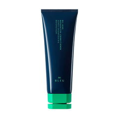 R+Co BLEU De Luxe conditioner bottle pouring for smooth, hydrated hair.
