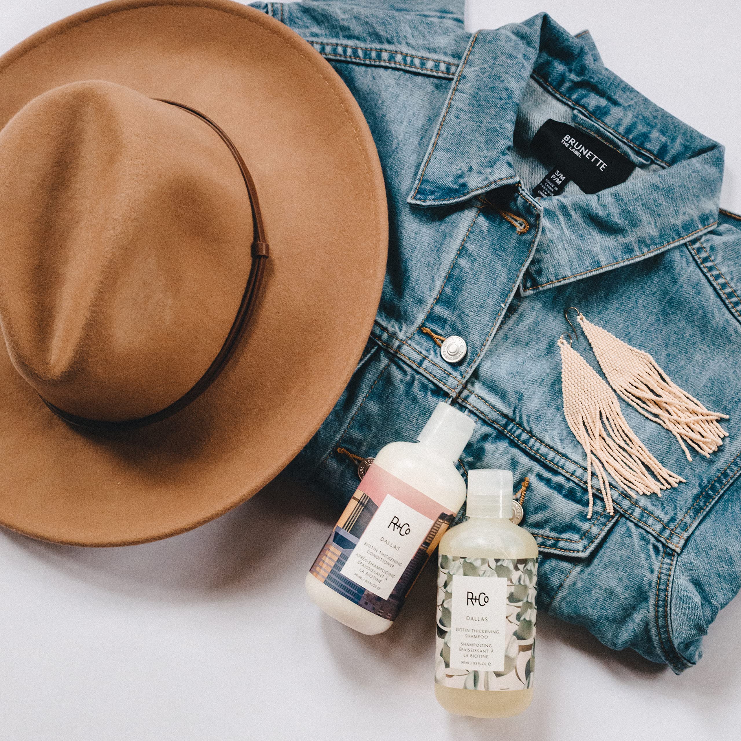 R+Co Dallas shampoo close-up bottle emphasizes premium formula