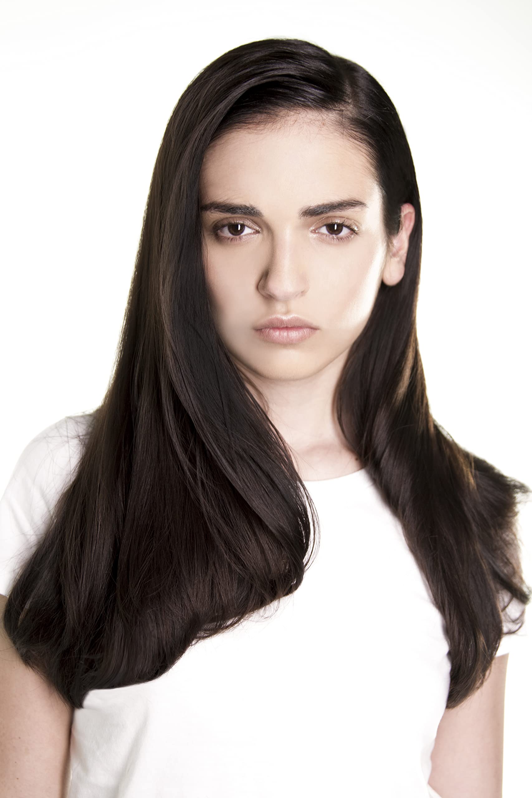 R+Co Foil Frizz Static Spray close-up highlights protective mist for heat styling.
