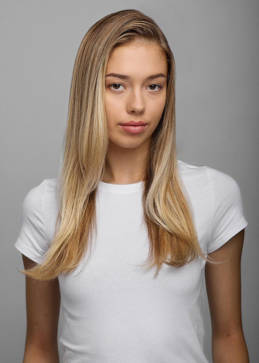 R+Co Hot Spell balm applied to damp hair ready for blow dry smoothing