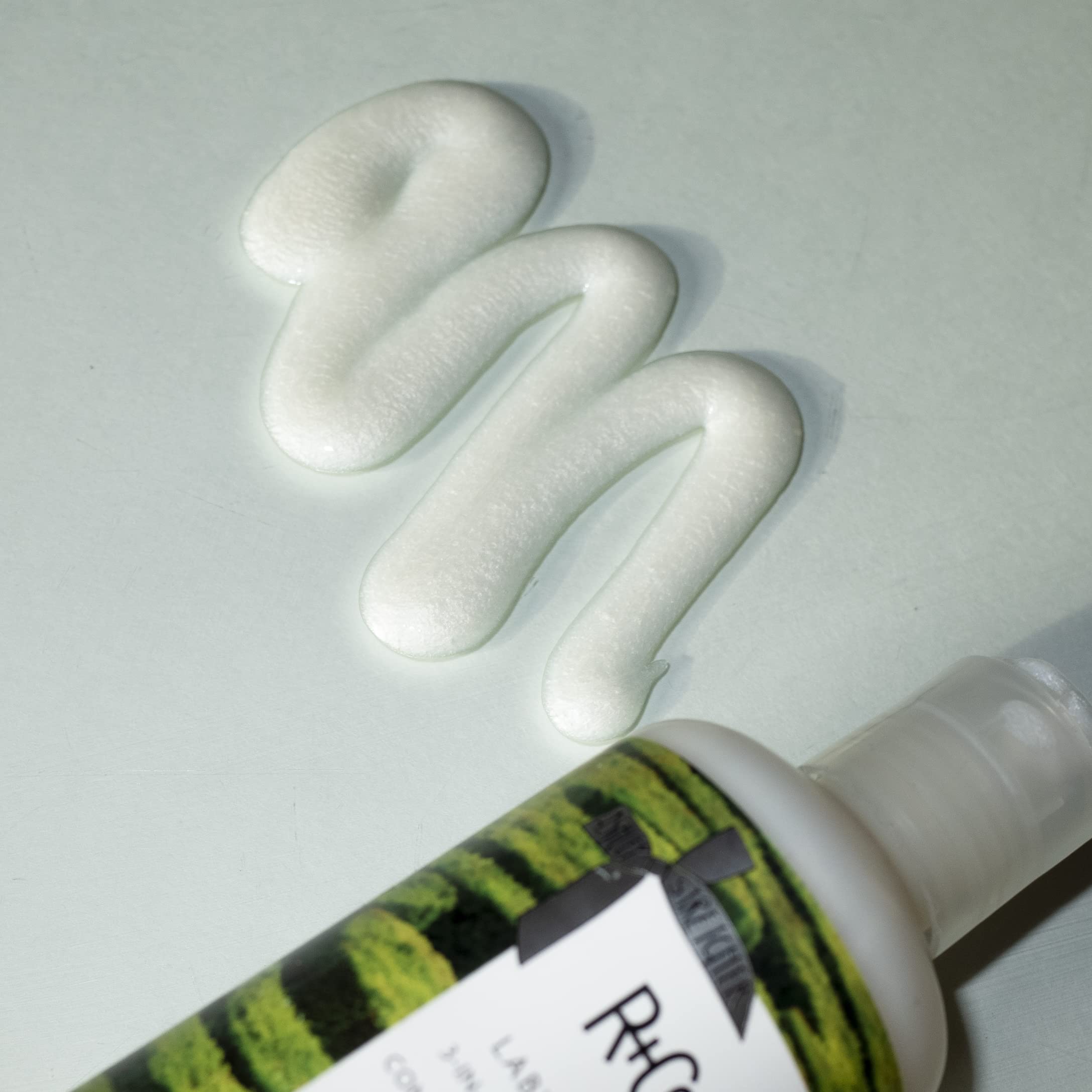 R+Co Labyrinth textured hair after shower scene shows lift and hydration.