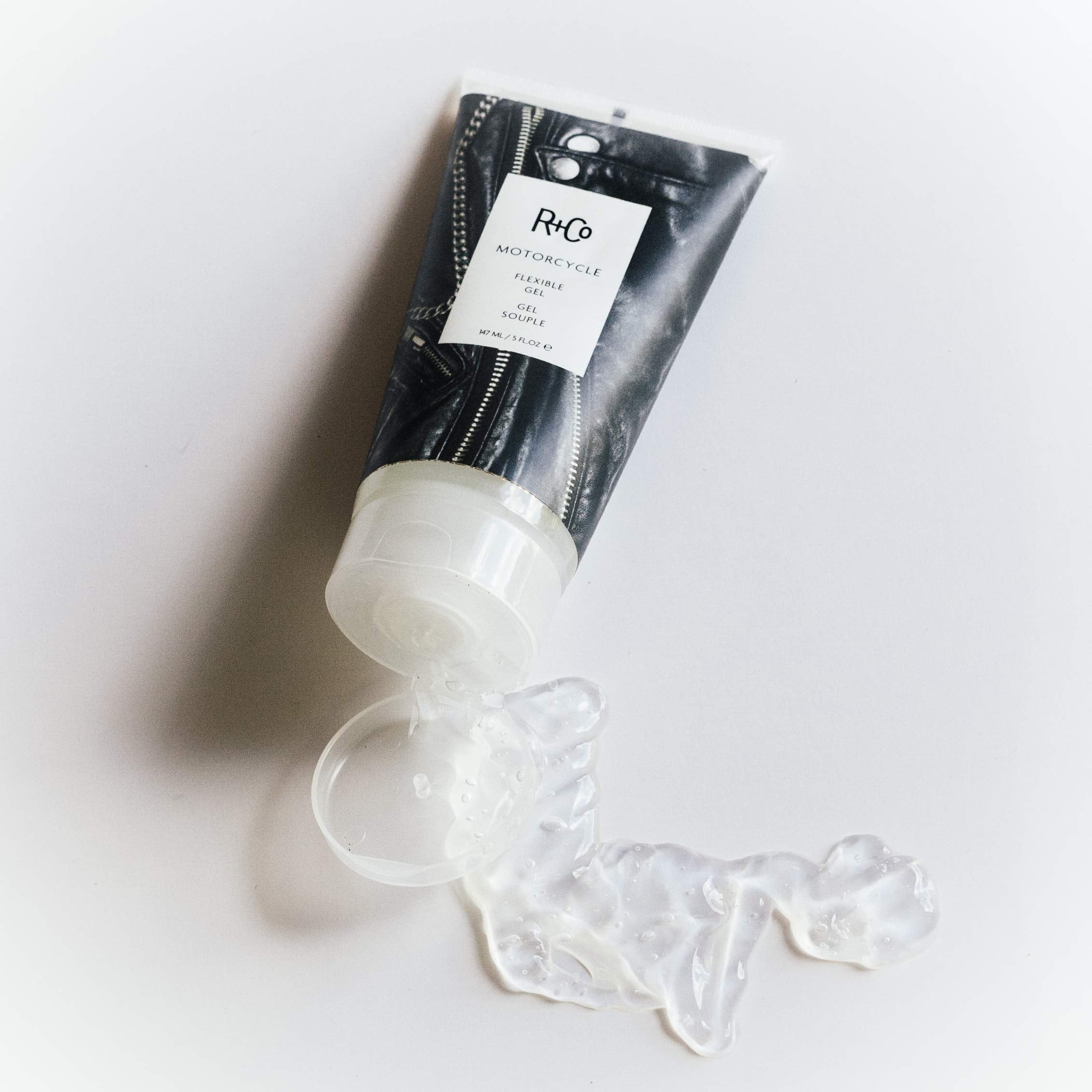 R+Co Motorcycle gel application on hands showing flexible control.