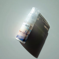 R+Co Skyline dry shampoo featuring jojoba oil close-up for added shine.