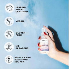 R+Co Skyline dry shampoo powder application targeting roots for a refreshed look.