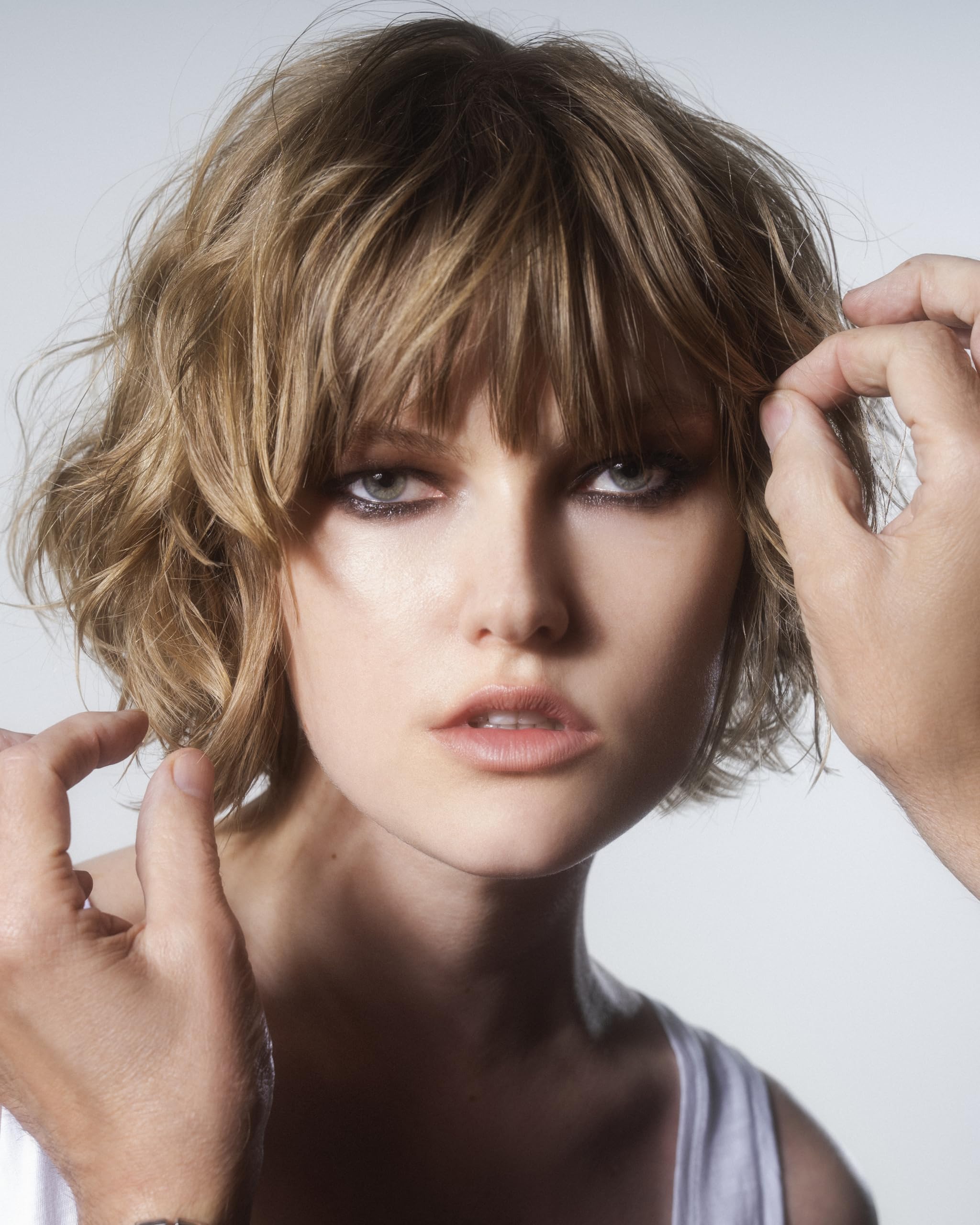 R+Co SUN CATCHER mist applied to hair for frizz control and shine.