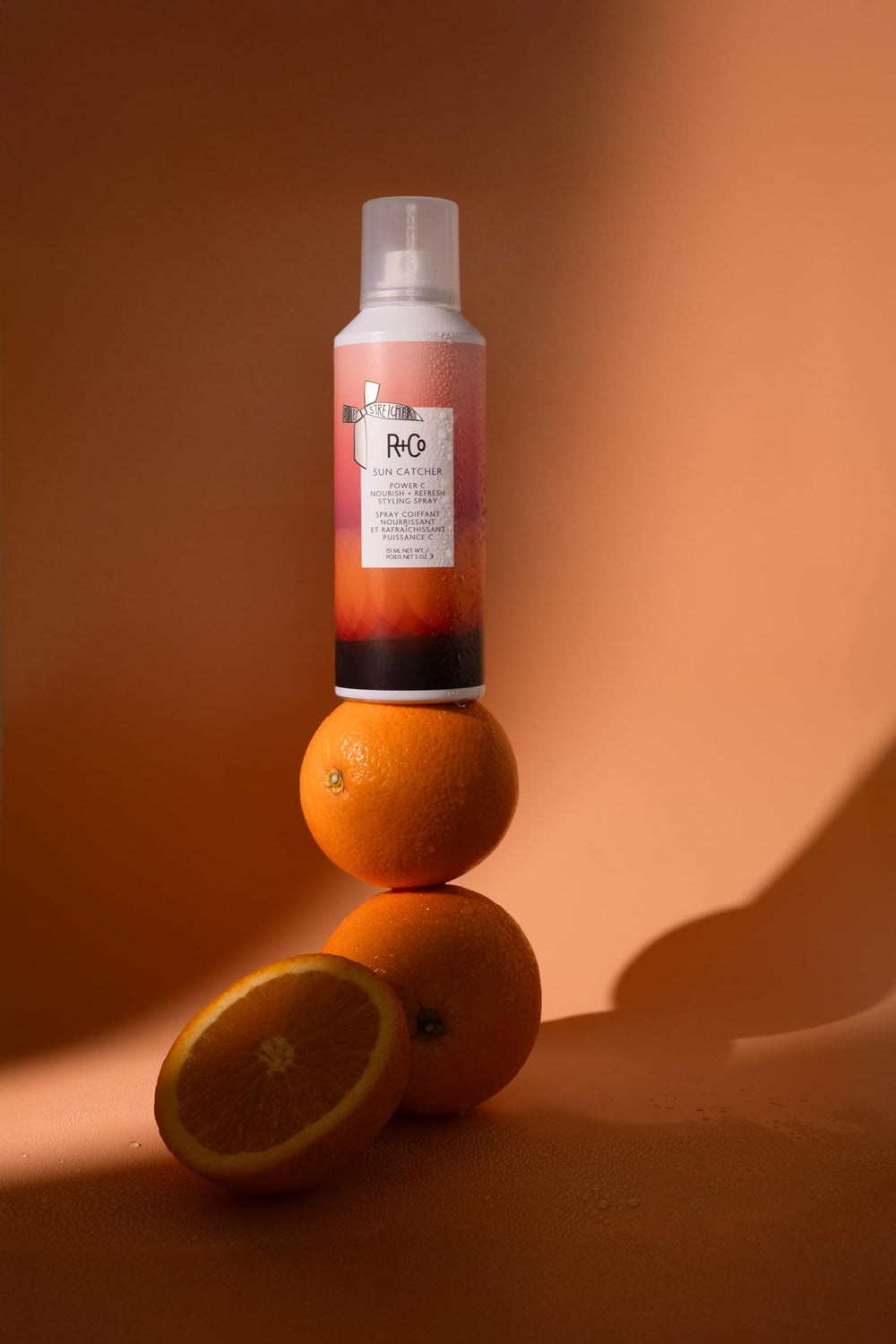 R+Co SUN CATCHER finished hair with shine and bounce after spray.