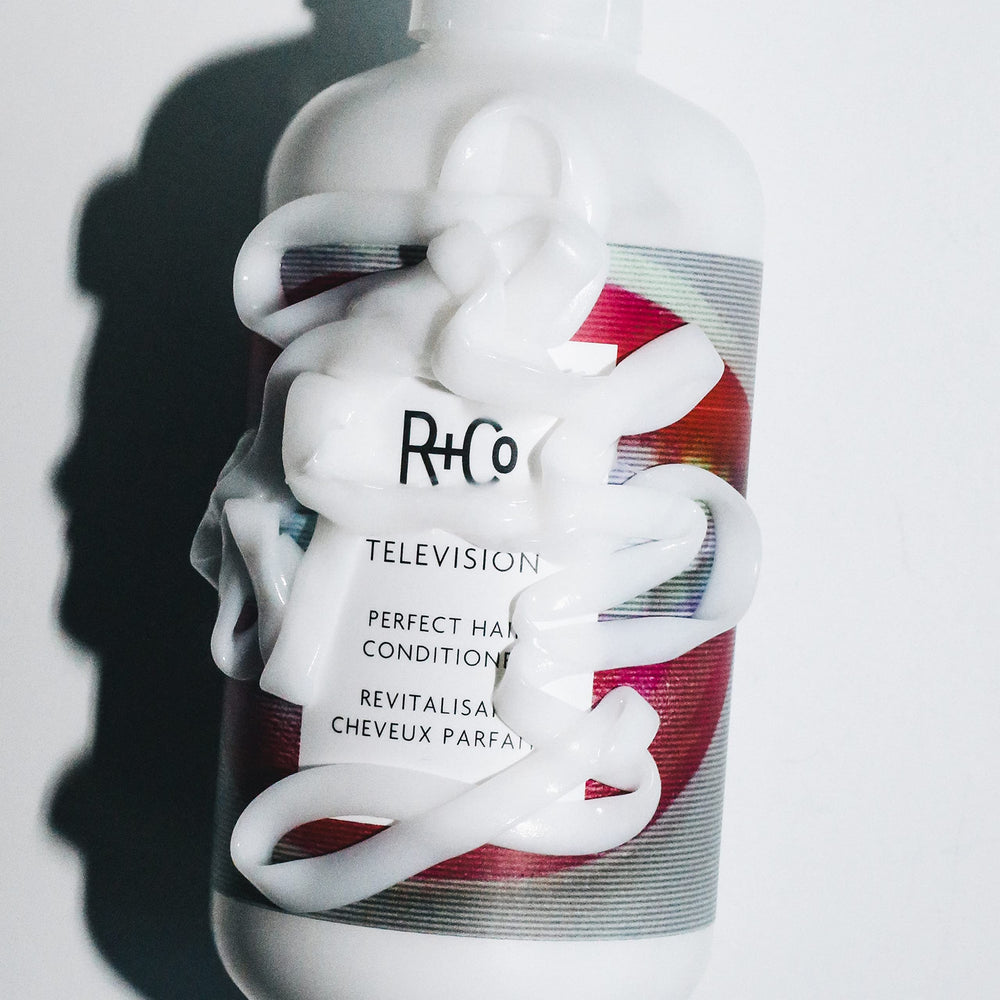 R+Co Television Conditioner texture closeup shows creamy formula delivering shine