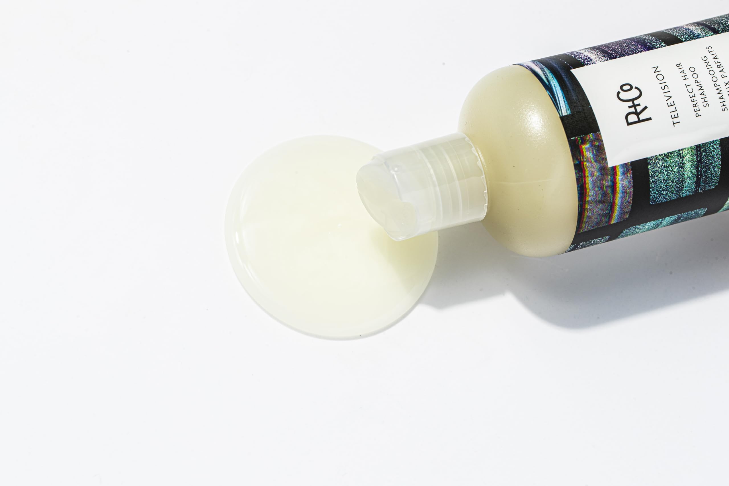 R+Co Television Perfect Hair Shampoo vegan cruelty-free badge beside the bottle emphasizes ethics.