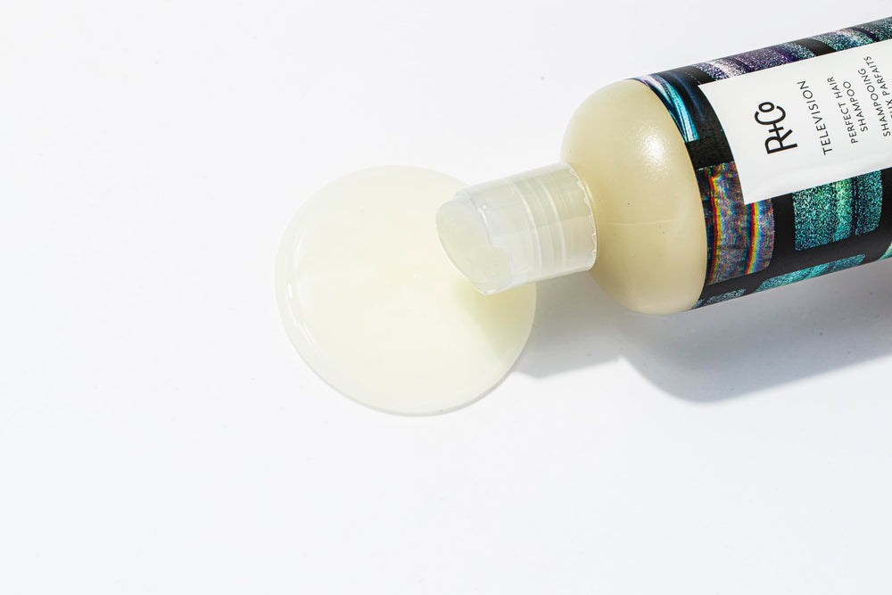 R+Co Television Perfect Hair Shampoo vegan cruelty-free badge beside the bottle emphasizes ethics.