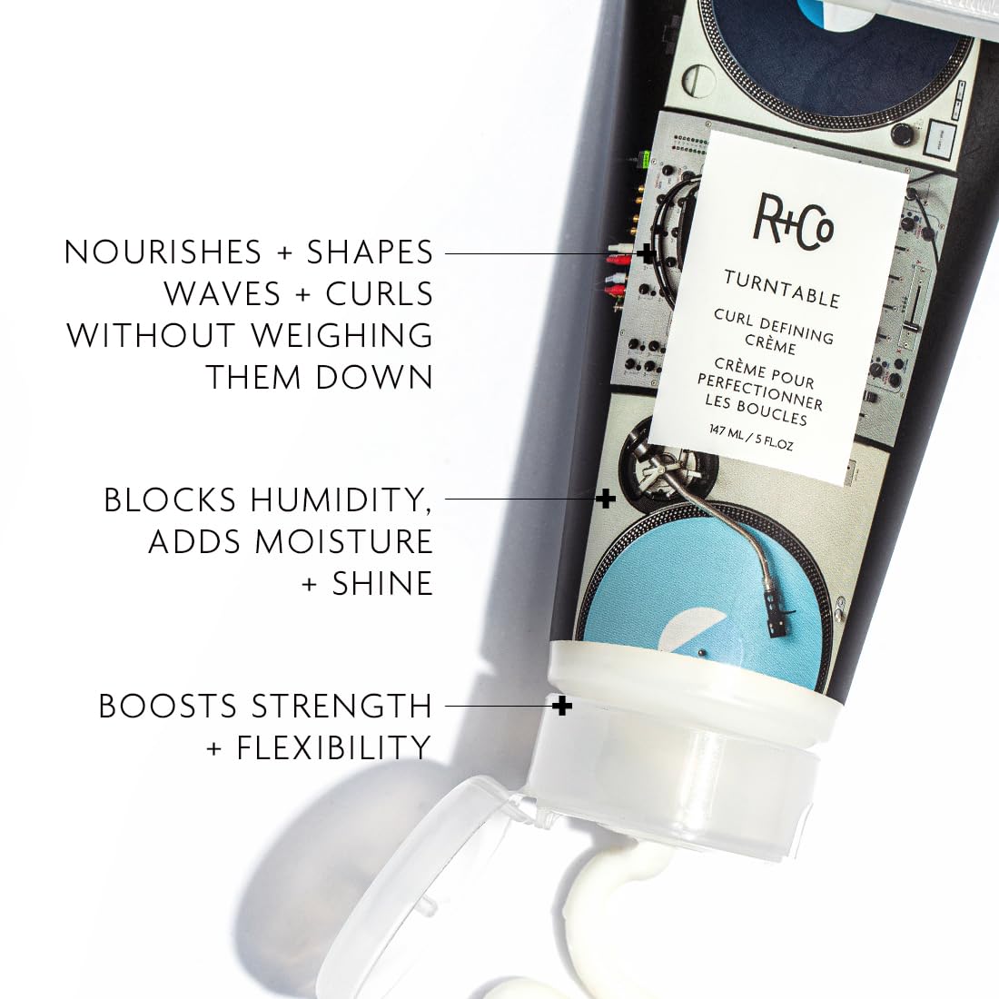 R+Co TURNTABLE label close-up emphasizing moisture-focused formula for defined curls