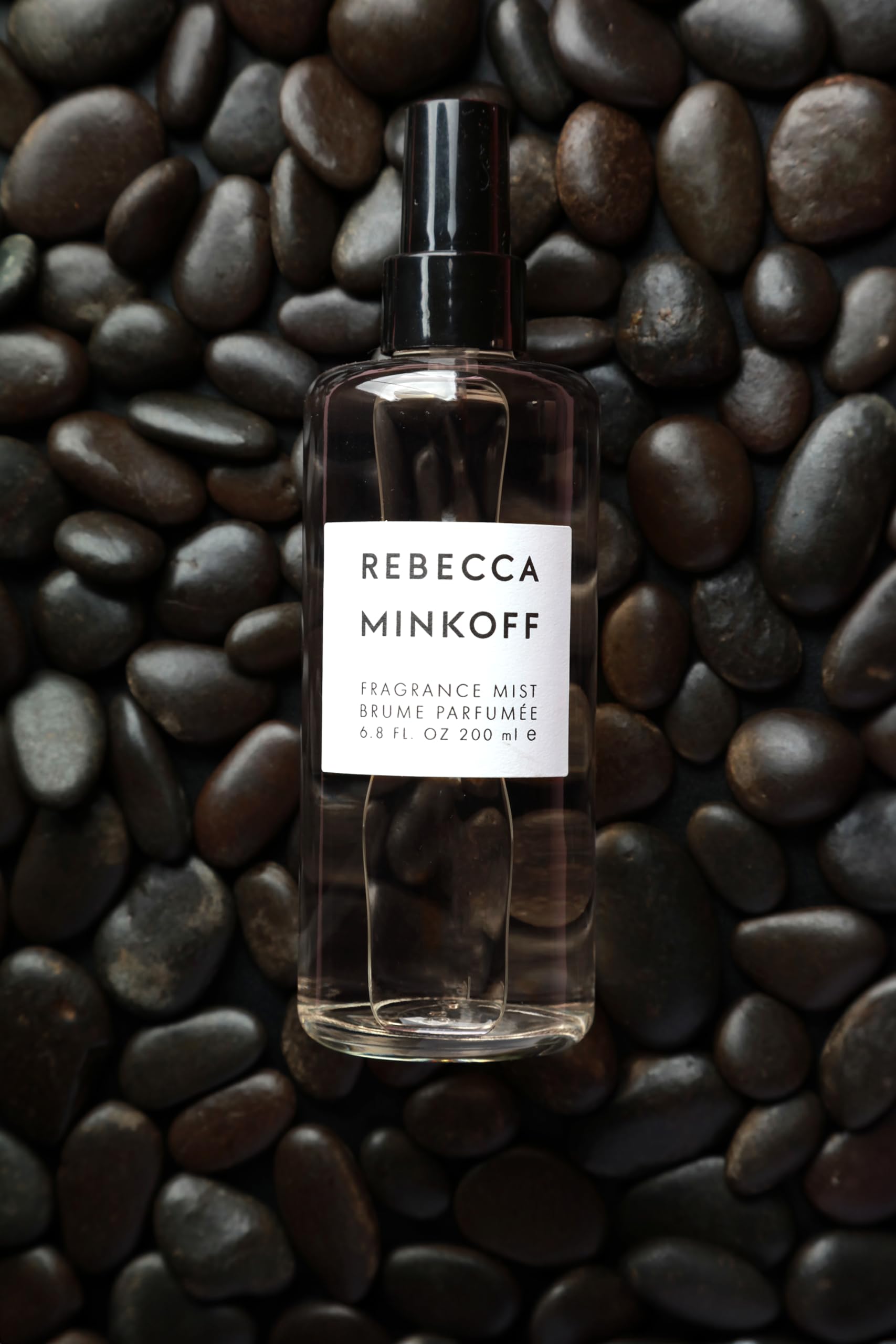 Rebecca Minkoff body spray application on wrist for quick refresh.