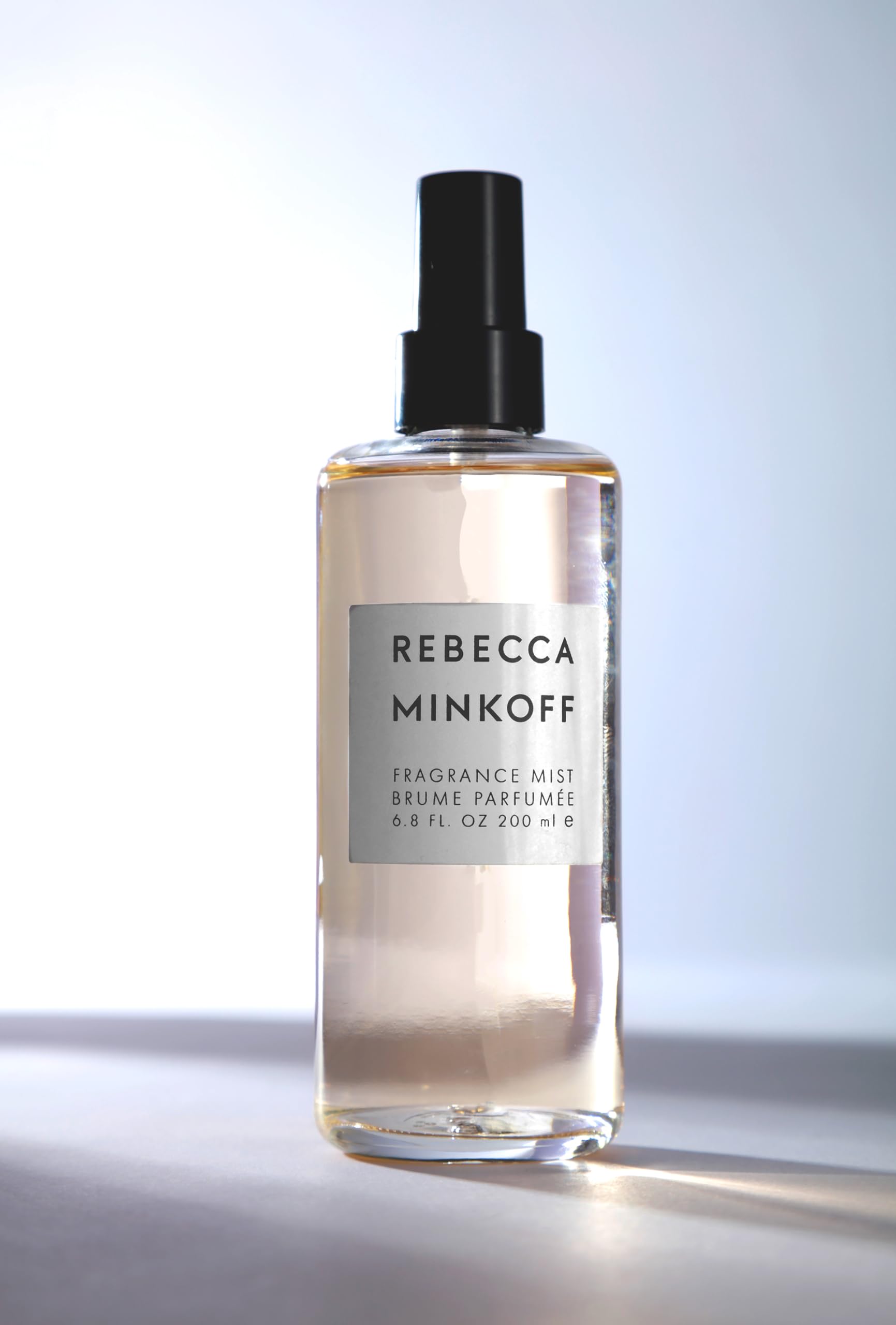 Rebecca Minkoff body spray top notes cardamom coriander bergamot deliver bright opening.