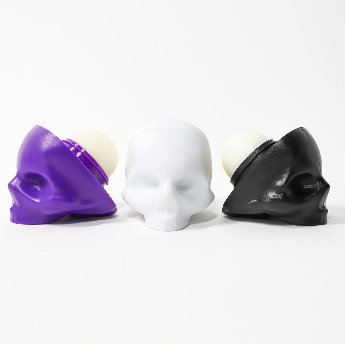 REBELS REFINERY bundle display featuring three skull lip balms for gifting