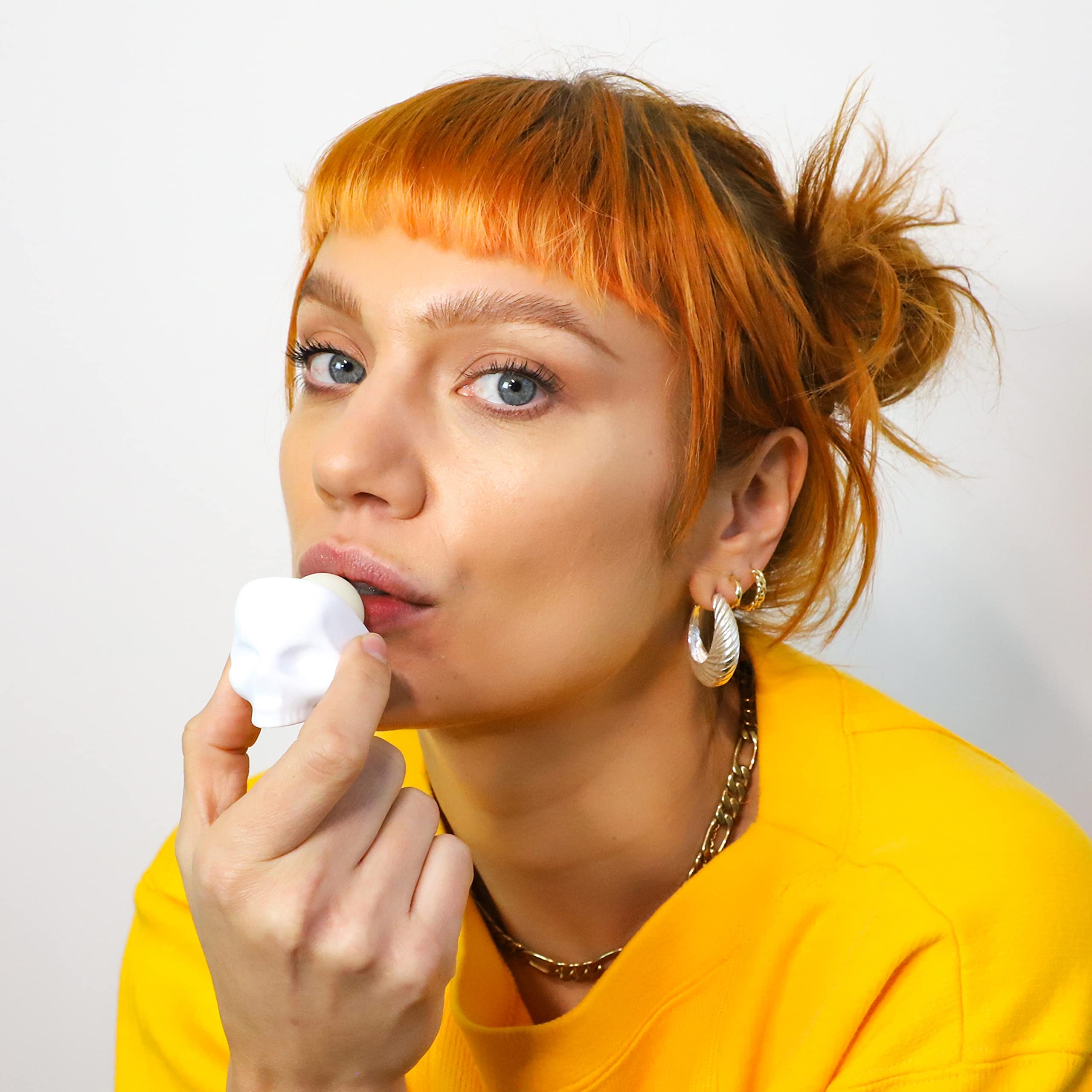 REBELS REFINERY lip balm on lips showing a shine-free matte finish