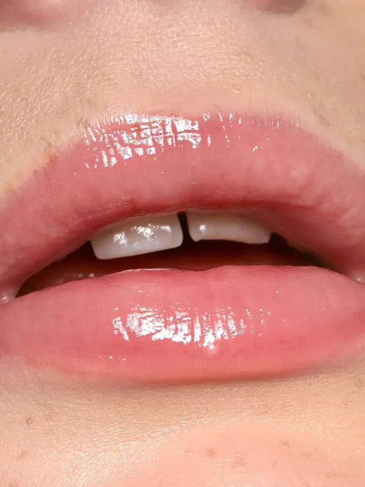 REFY Lip Gloss Blush swatch shows light neutral pink for daily wear and layering