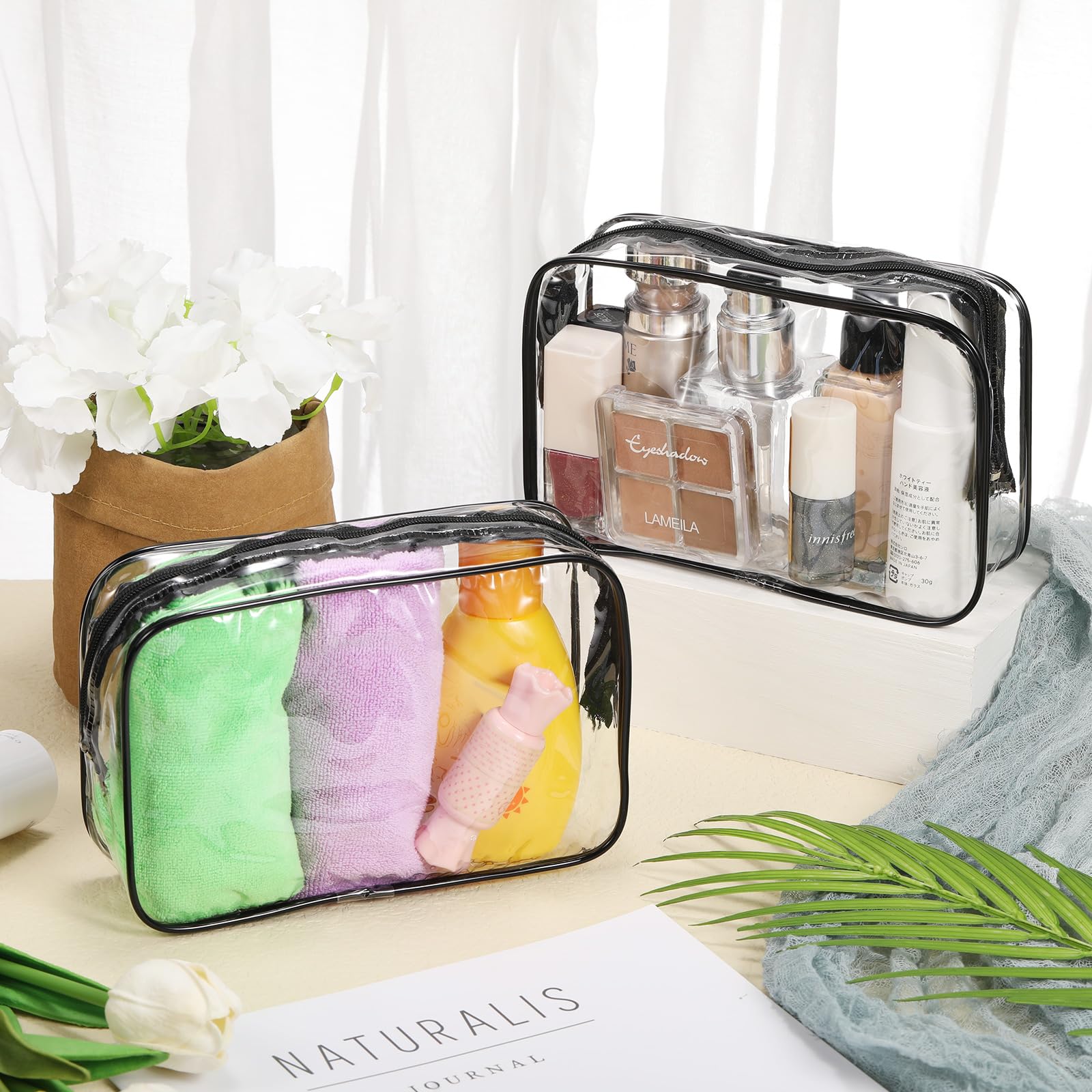 Reginary waterproof PVC cosmetic bags side zipper protects contents during travel.