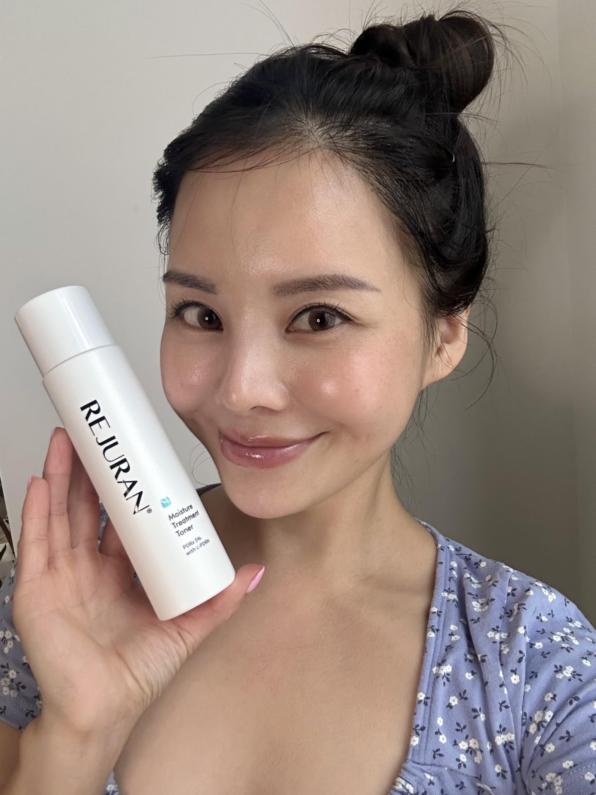 REJURAN Moisture Treatment Toner on bathroom shelf highlighting hydration and barrier support.
