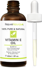 RejuveNaturals Vitamin E oil bottle closeup, pure olive-derived oil for skin nourishment.