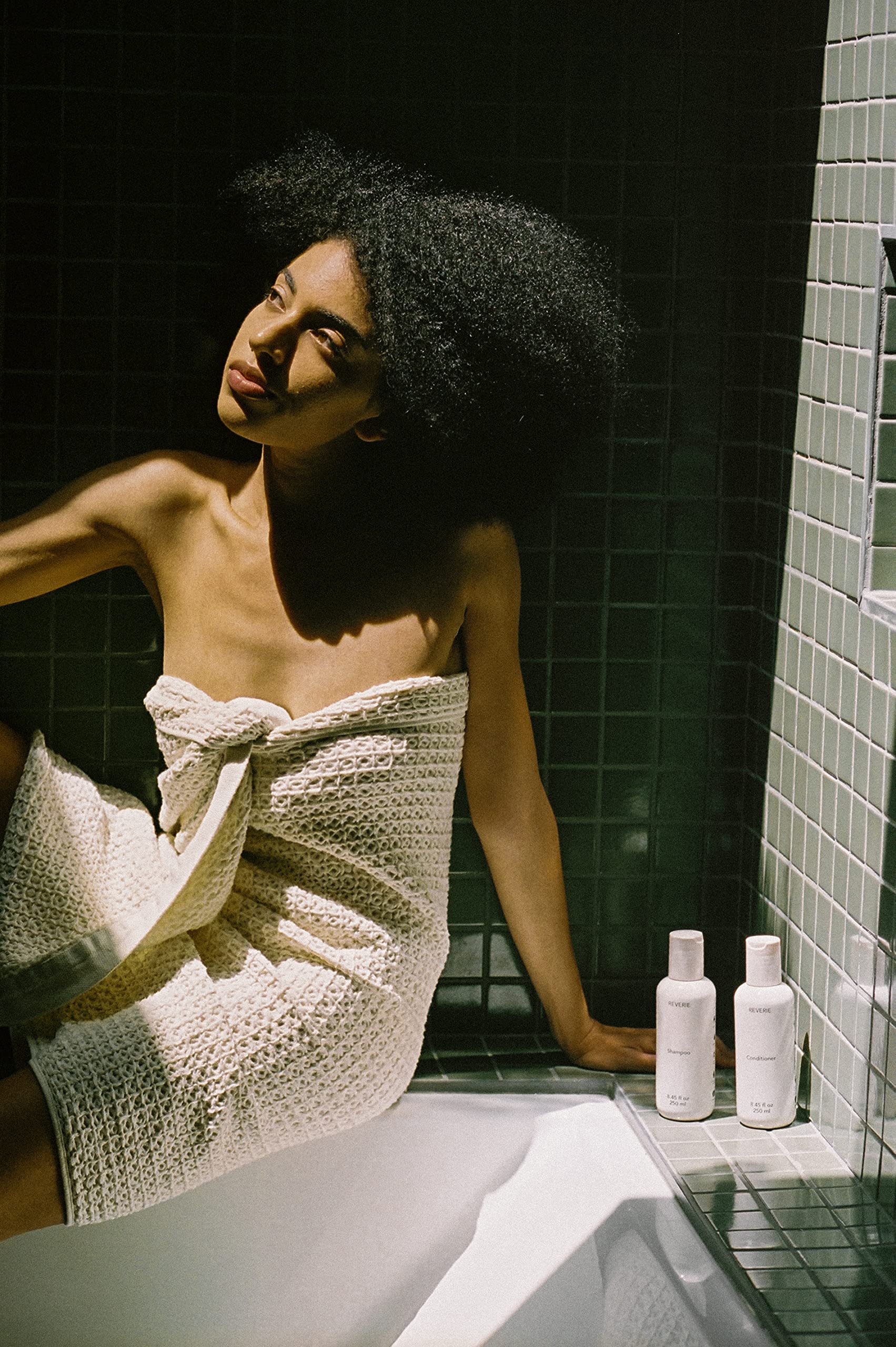 REVERIE Natural Balancing Shampoo color-treated hair image conveys safe formula for vibrant color.