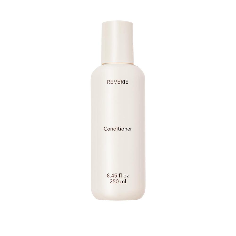 REVERIE Natural Nourishing Conditioner bottle delivering weightless hydration.