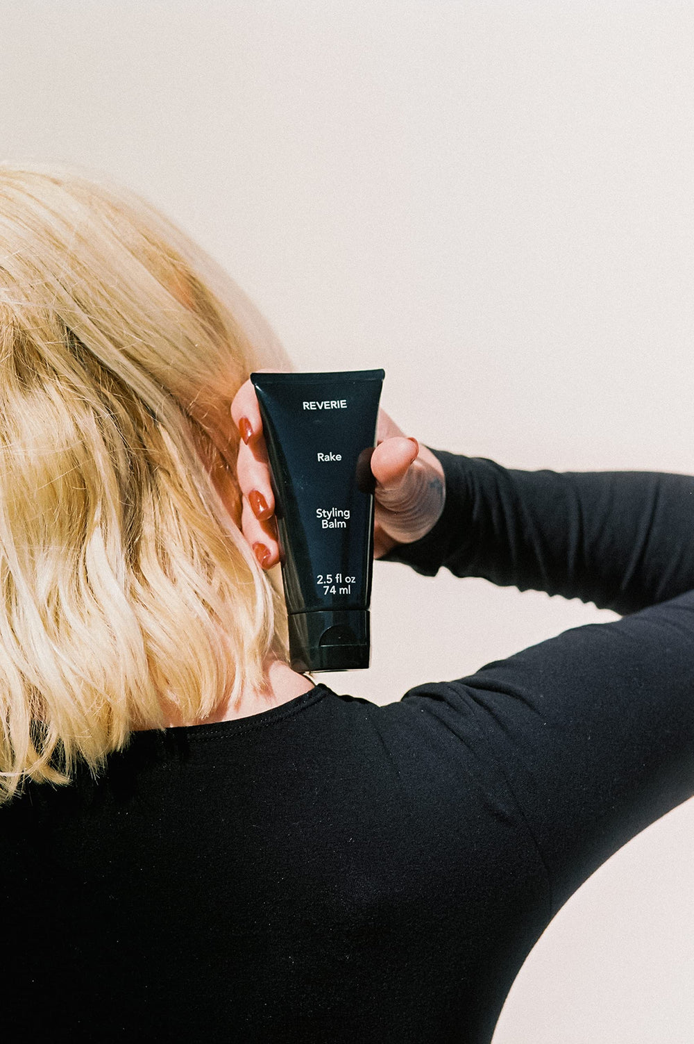 REVERIE balm applied for air-dried looks with frizz control and natural sheen.