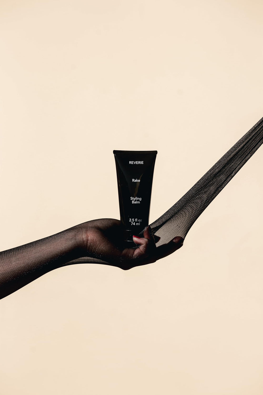 REVERIE Natural Rake Styling Balm defines curls with touchable hold and light conditioning.