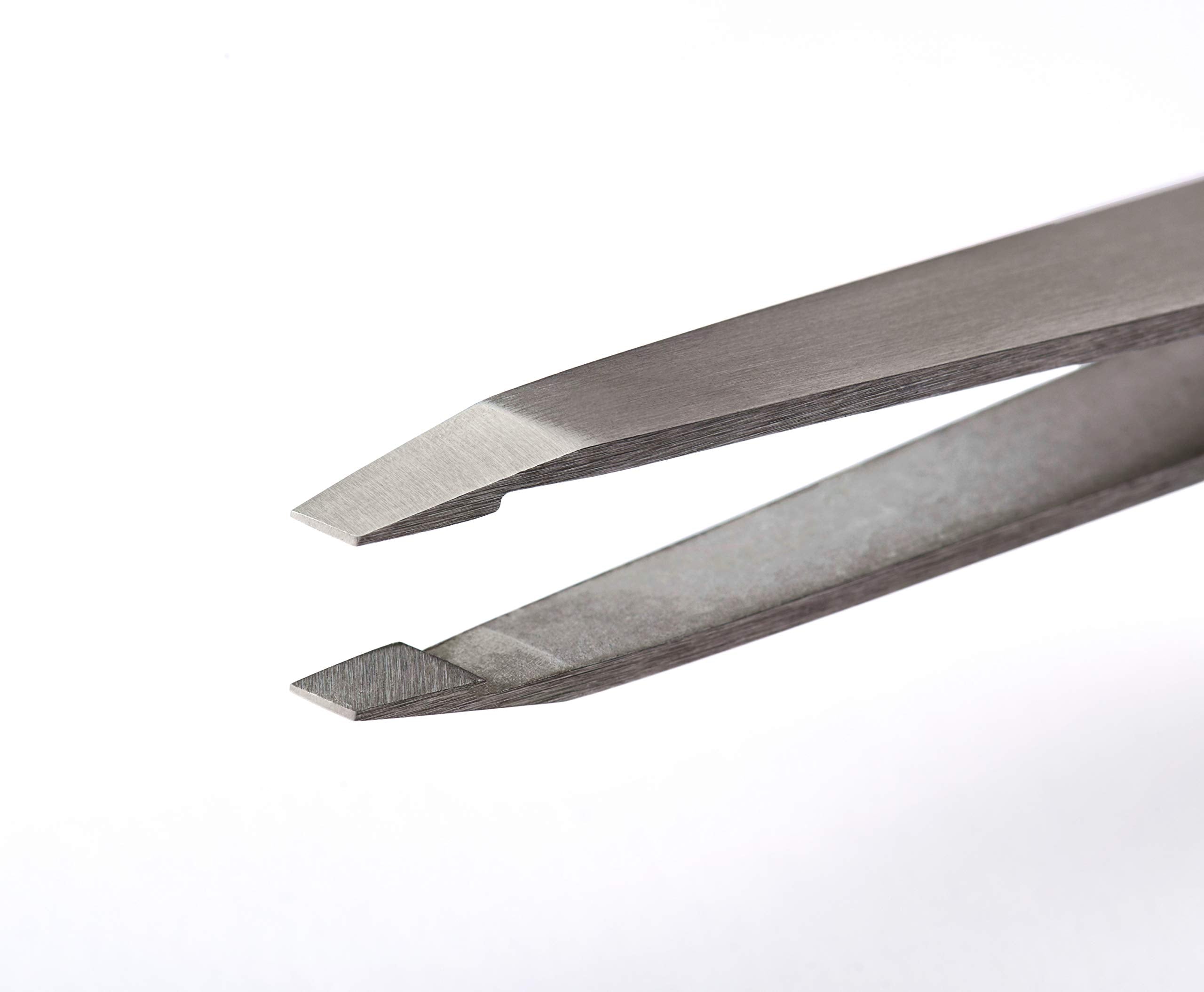 RevitaLash tweezers on sterilization tray indicating salon-ready hygiene and longevity