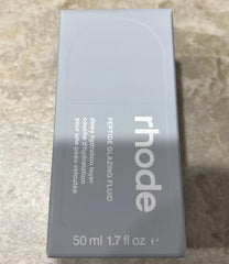 Rhode Barrier Restore Cream being massaged into the face for instant absorption.