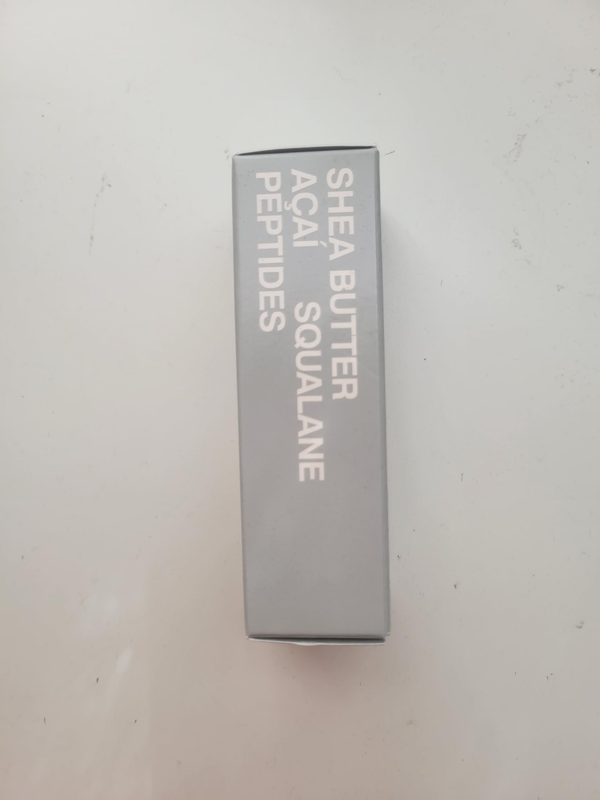 Rhode Barrier Restore Cream packaging on white backdrop reflects premium skincare.