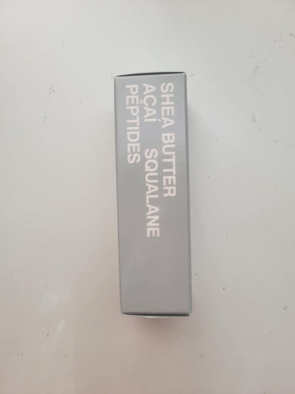 Rhode Barrier Restore Cream packaging on white backdrop reflects premium skincare.