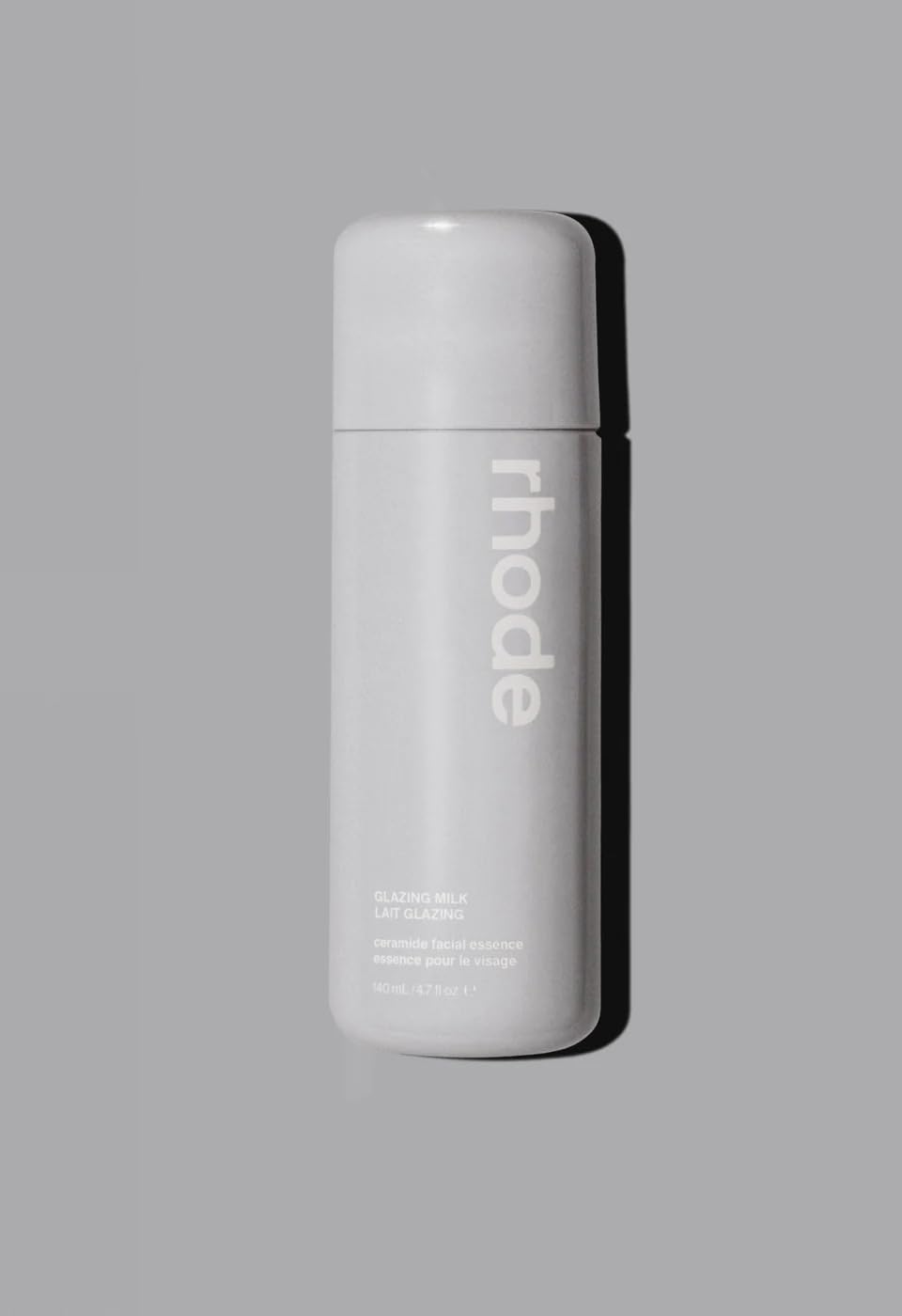 Rhode Glazing Milk bottle pour demonstrates lightweight hydration for radiant skin.