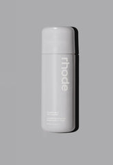 Rhode Glazing Milk bottle pour demonstrates lightweight hydration for radiant skin.
