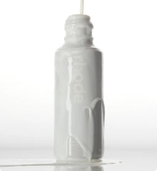 Rhode Glazing Milk hands-press shows gentle application for improved absorption.