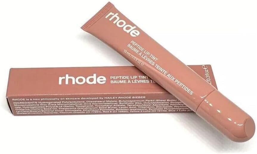 Rhode Gloss Lip Tint Toast application close-up delivers sheer color for a natural, everyday glow.