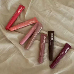 Rhode Gloss Lip Tint Toast on lips demonstrates hydrating shine in a lightweight formula.