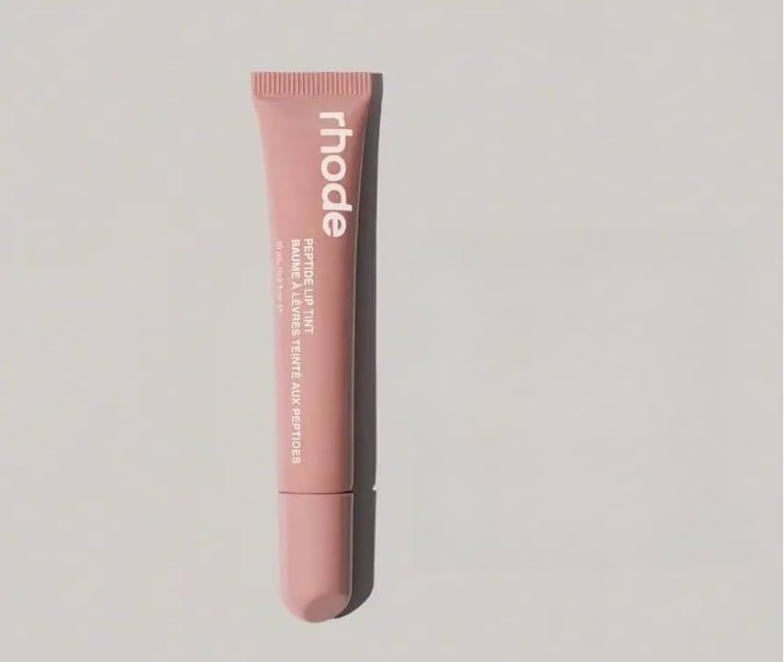 Rhode Lip Tint Toast Rose Taupe delivers sheer color with glossy finish and lip hydration.