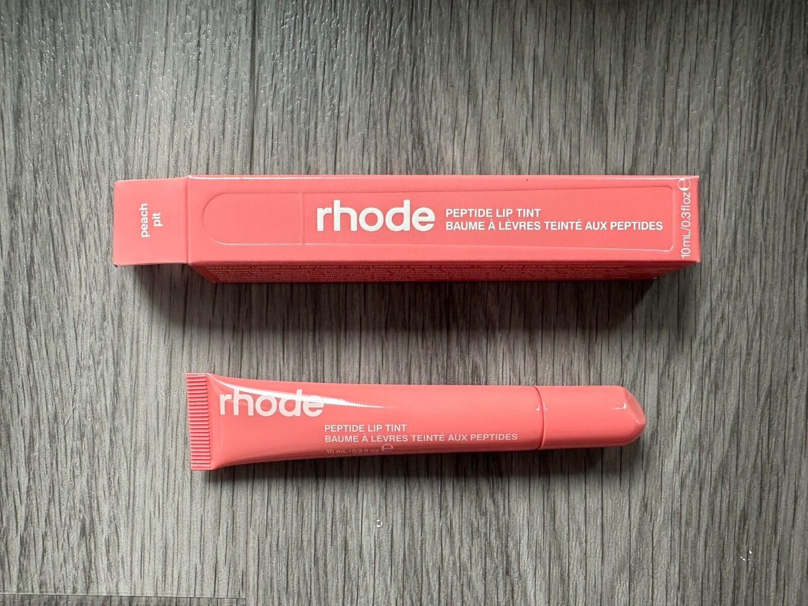 Rhode Peach Pit 8ml tube compact for on-the-go touch-ups.