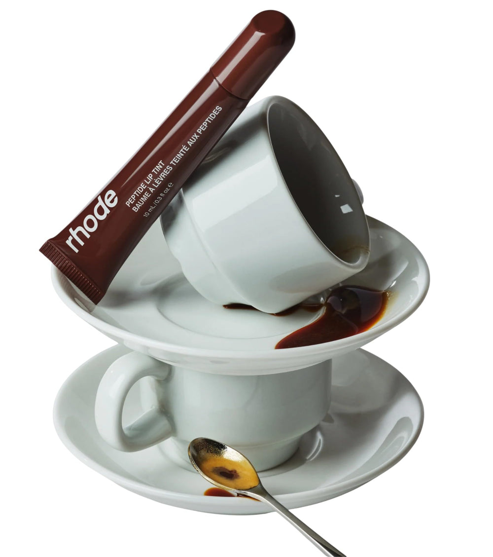 Rhode Peptide Lip Tint Espresso demonstrates a glossy finish for dewy shine.