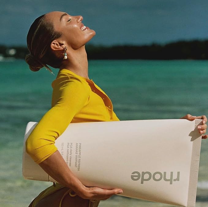 Rhode Pineapple Refresh Daily Cleanser foam on skin demonstrates light cleansing for mornings.